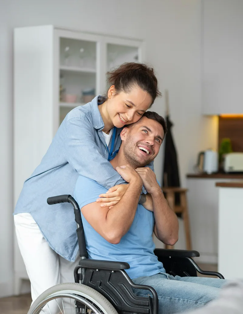 Disabled person hugged by his physician